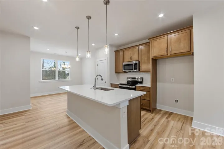Chef-Inspired Kitchen with Warm Brown Cabinets