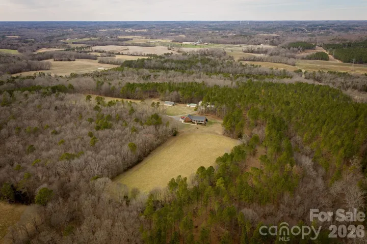 44 acres, 3bed/2 bath brick ranch, barns, shops, and more!