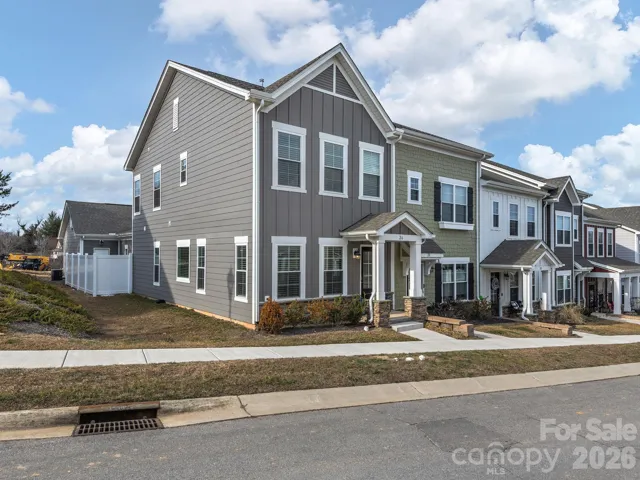 Townhome PERFECTION with PRIMARY ON MAIN and Private Outdoor Spaces You'll Love + Two Car Garage!