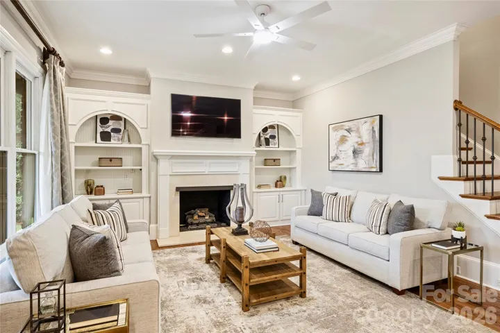 Beautiful family room with second hardwood staircase access to second floor 