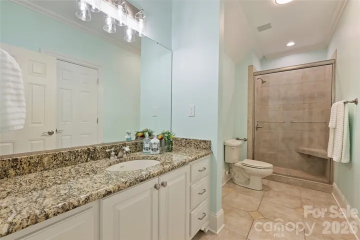 Full bathroom with access to bonus area and bedroom