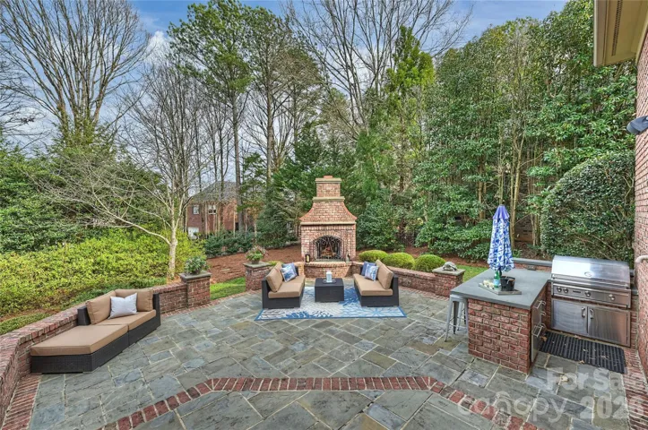 Entertain most of the year with this gorgeous outdoor fire place and kitchen