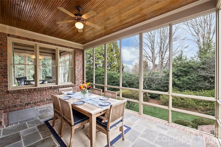 Beautiful screened in porch with bluestone floors