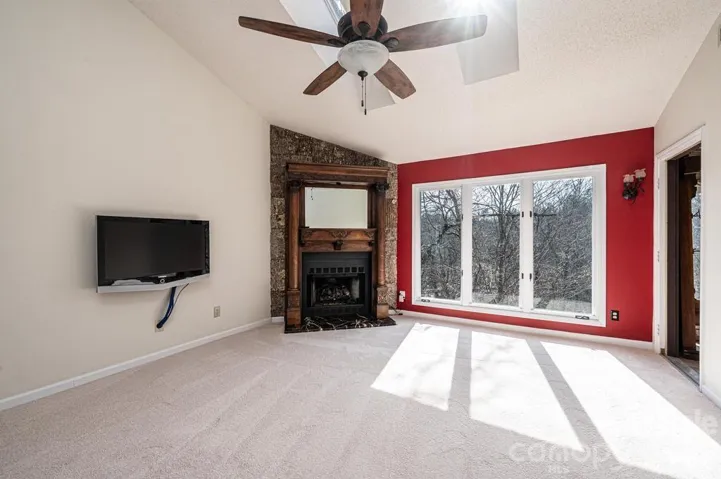 The focal point of this large living room is the antique mantle from the early 1900's made of solid oak!  And surrounding the mantle is actual bark, pressed flat!  The hearth is solid black marble.