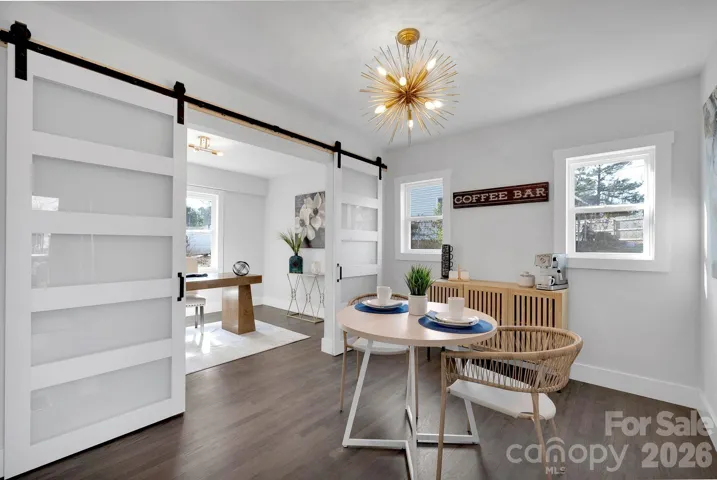 Flex Space / Breakfast Nook – Versatile flex area with sliding barn doors, perfect for a home office, coffee bar, or additional dining space.