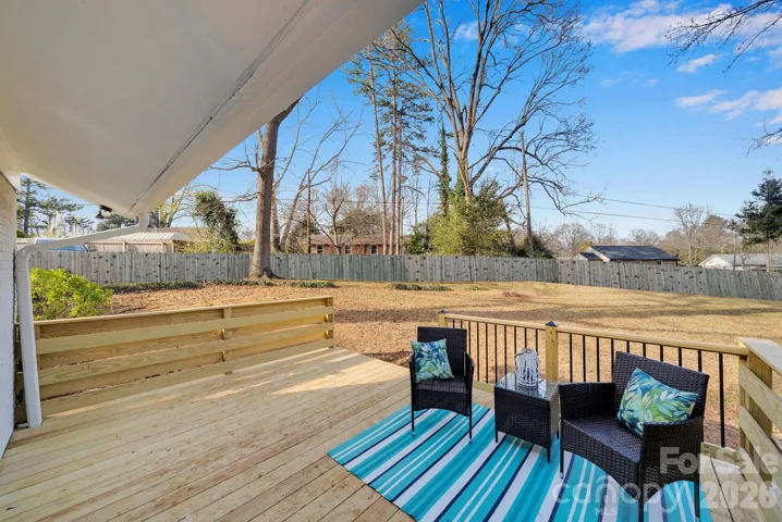 Deck Seating Area – Inviting deck space with room for outdoor seating, perfect for enjoying peaceful backyard views.