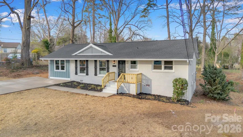 Front Yard – Generous front yard framed by mature trees, offering a peaceful setting and plenty of outdoor potential.