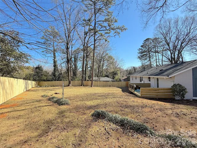 Backyard & Deck – Spacious rear yard paired with a newly constructed wood deck, creating an ideal setup for outdoor entertaining.