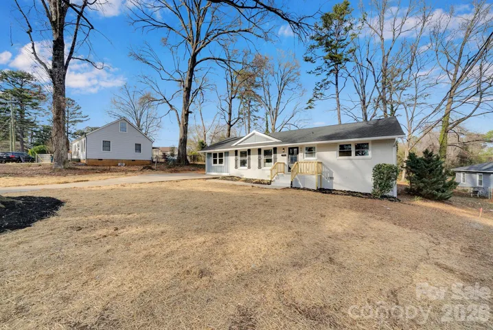 Front Yard – Generous front yard framed by mature trees, offering a peaceful setting and plenty of outdoor potential.