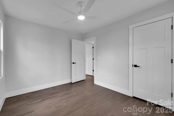 Bedroom (Alternate View) – Light-filled room with updated doors and trim, offering a fresh, move-in-ready feel.