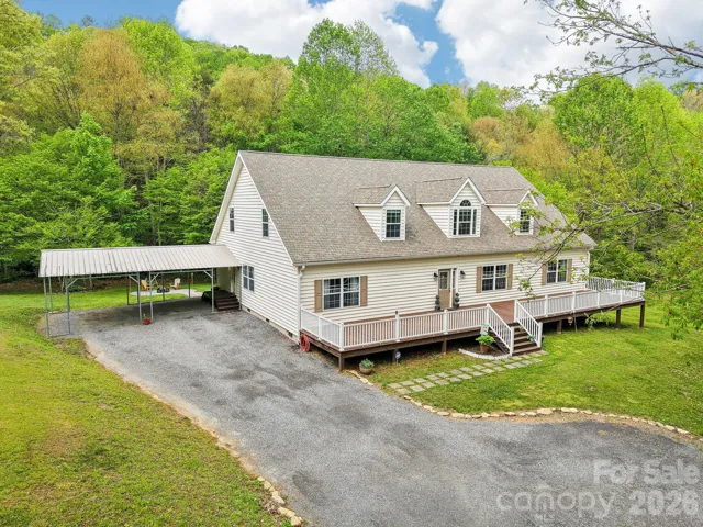 Generous parking space in the carport and driveway