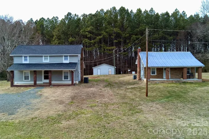 Large 3 bedroom home with guest house on shared 1.1 acre parcel with separate driveways and utilities