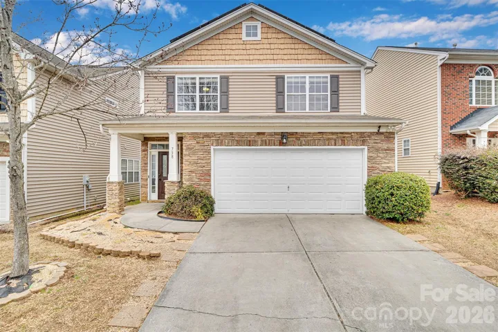 WELCOME HOME! 4Br/2.5BA 2100SF Home w/Stone veneer and large driveway.