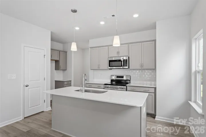 Homesite 10 features an end-unit Cannalily C floorplan! Please note that photos are representative only.