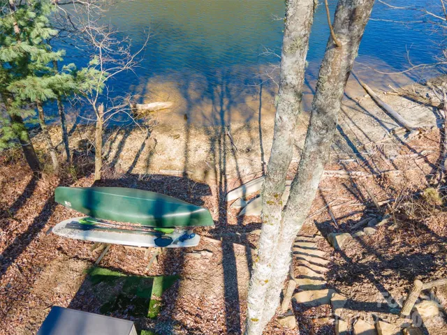 Stone steps to lake with Canoe and Paddle board