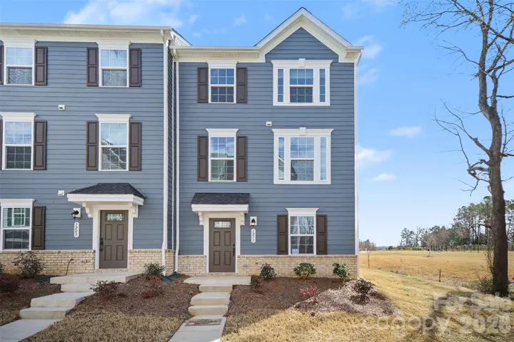 Charming end-unit townhome with partial front brick accent