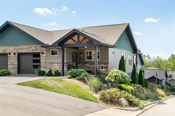 Lovely and easy no steps entrance with covered front porch!