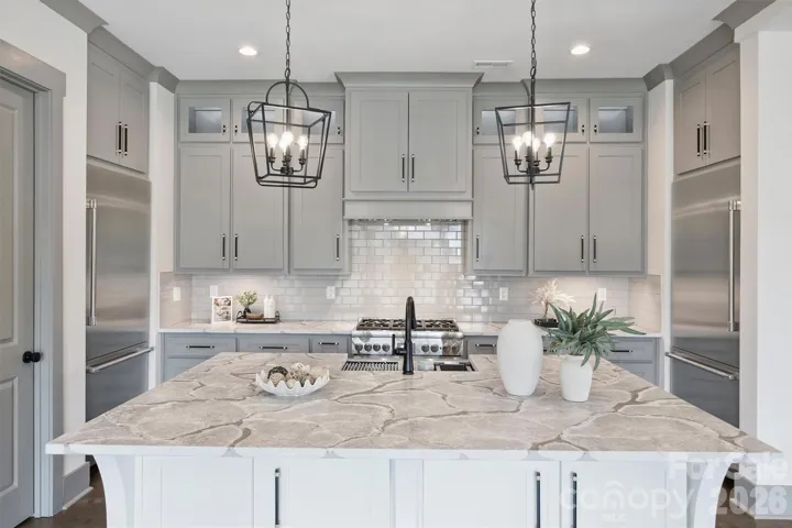 Oversized Island with Beautiful leathered Quartz countertops and Underneath Storage
