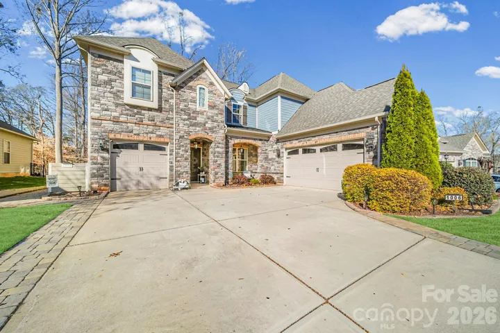 Beautifully landscaped with mature trees and stonework
