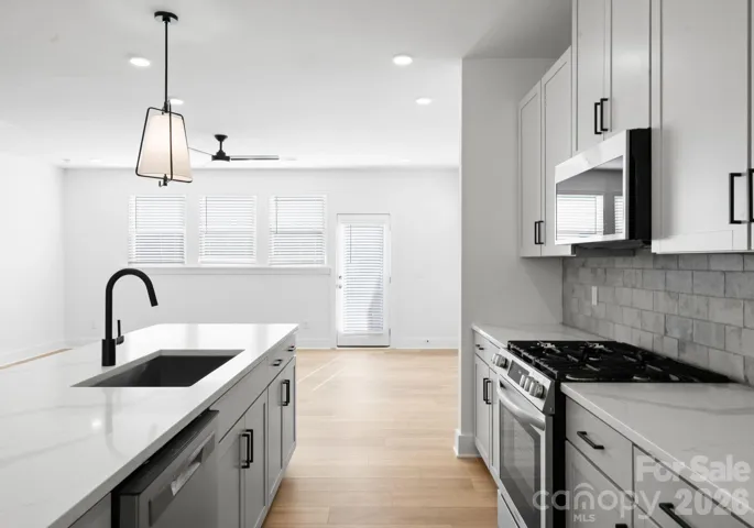 Luxury Kitchen with Gas Range and Stainless Steel Appliances