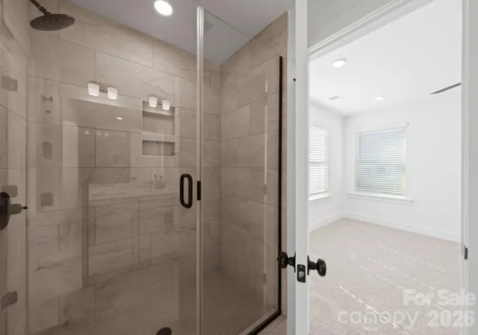 Primary Bathroom with Floor to Ceiling Tiled Shower