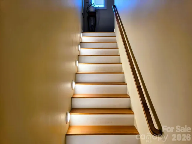 Stairs connecting main level and lower level