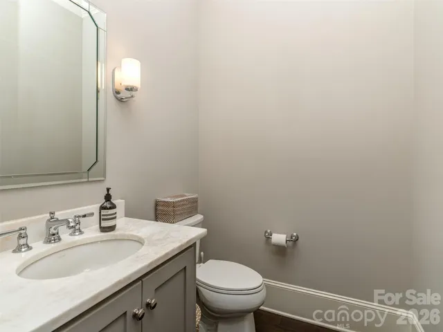 Main Floor Guest Bath Discretely Located.