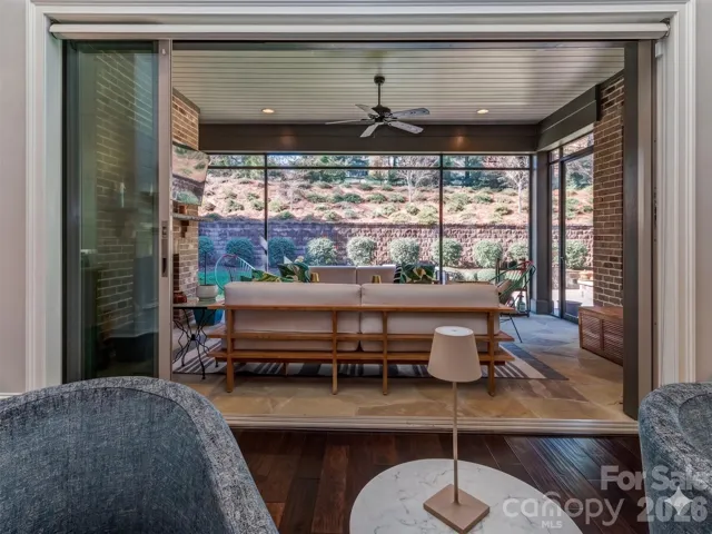 Spectacular Screened Porch with 3 Panel Sliding Glass Door that Recesses when fully opened, Stacked Brick Gas Fireplace, Recessed Lighting overlooking your Completely Private Rear Yard!
