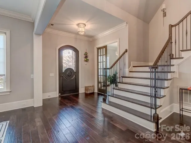The Dramatic Foyer is anchored between the Formal Dining Room & Home Office/Study