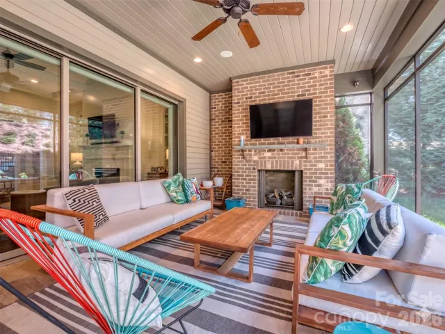 Spectacular Screened Porch with 3 Panel Sliding Glass Door that Recesses when fully opened, Stacked Brick Gas Fireplace, Recessed Lighting overlooking your Completely Private Rear Yard!