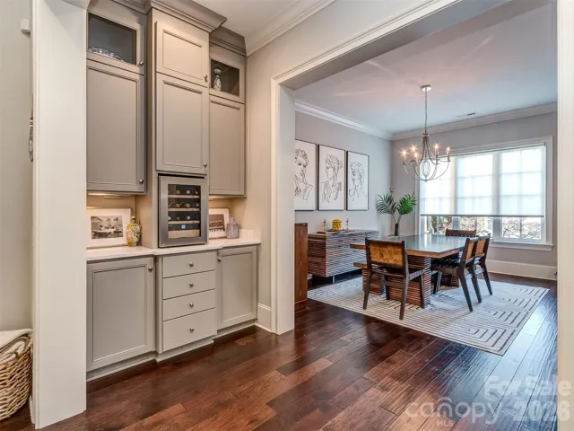 Perfect for Entertaining and nestled between the Formal Dining Room, Kitchen, & Great Room, is your Butler's Pantry / Bar Area