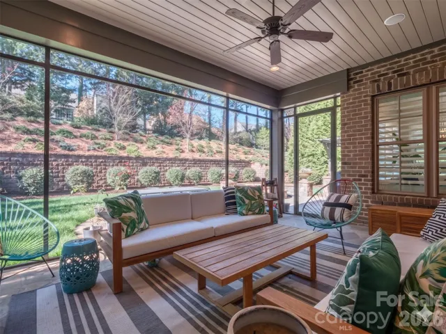 Spectacular Screened Porch with 3 Panel Sliding Glass Door that Recesses when fully opened, Stacked Brick Gas Fireplace, Recessed Lighting overlooking your Completely Private Rear Yard!