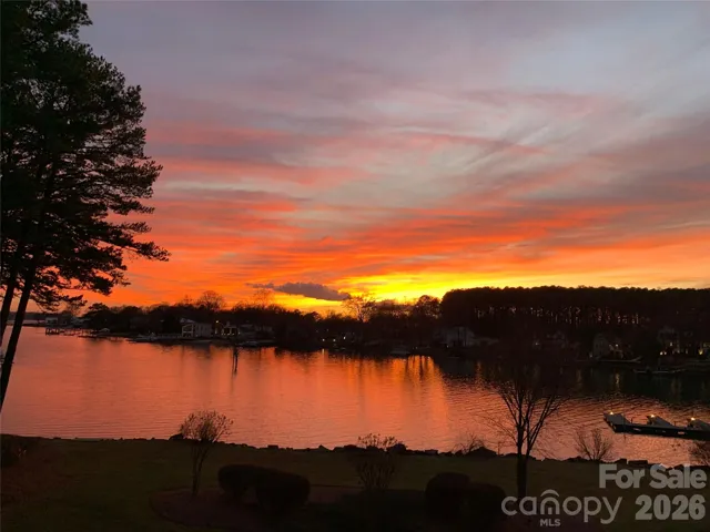 Stunning sunset views over the lake. Enjoy peaceful water vistas, colorful evening skies, and a relaxing lakeside setting from this desirable waterfront community. Perfect for those seeking a low-maintenance lifestyle with the beauty of lakefront living. Nearby docks, mature trees, and scenic surroundings create the perfect backdrop for everyday living. A wonderful opportunity to own a condo with breathtaking water views.