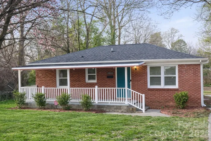 Sizeable front porch with newly installed rails!