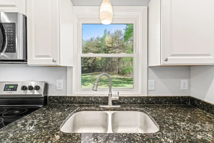 Kitchen Window overlooking back yard