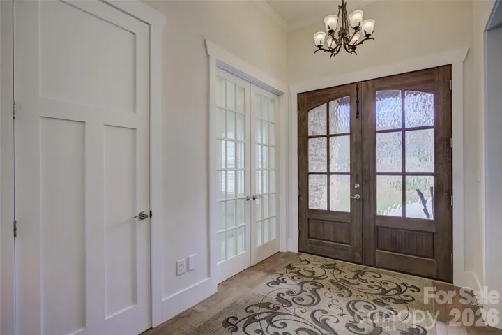 Custom front door. Hardwood floors.