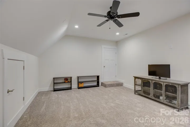 Media Room with walk-in storage off the back of the room. 