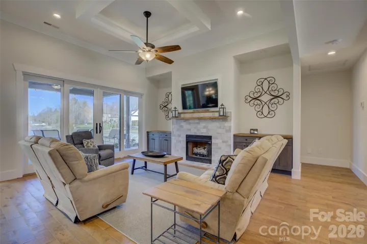 Great Room with hardwood floors and fireplace. Waterview.