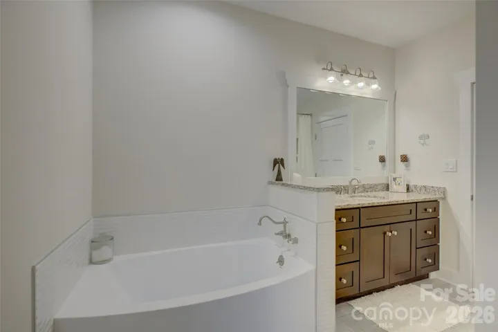 Bathroom #4 with tub and walk-in shower.