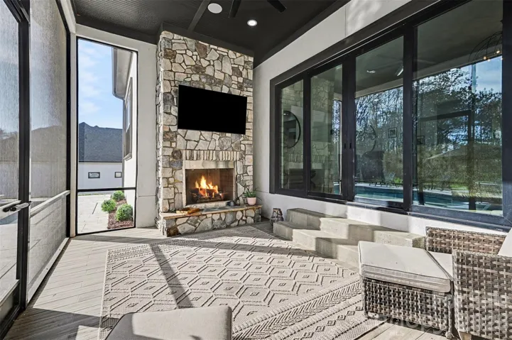 Screen porch with stone fireplace