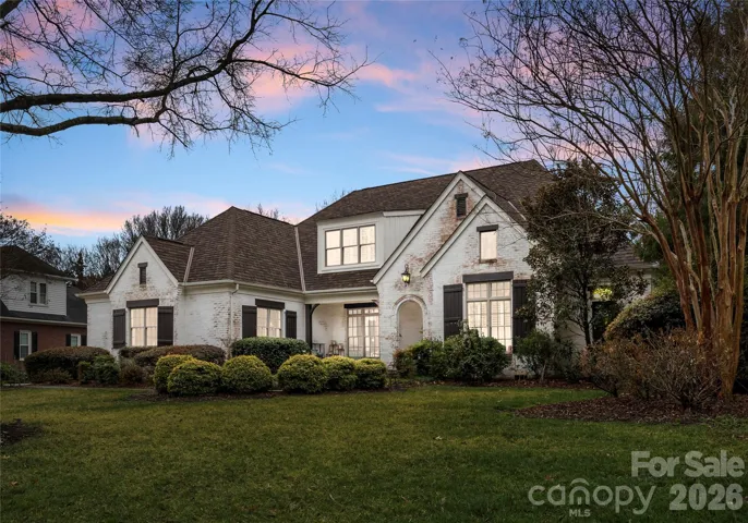 French Countryside meets Southern American Charm; a white washed full brick exterior with a brand new designer shingle roof
