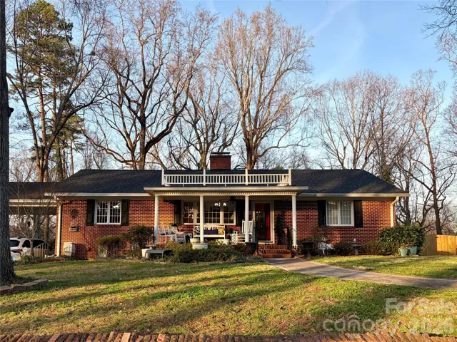 Frontt view of home with portico-style covered porch.