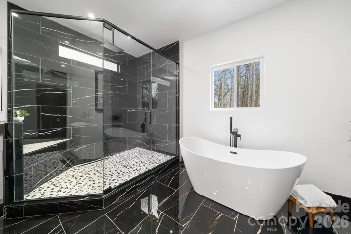 Primary bathroom with walk in shower and soaker tub
