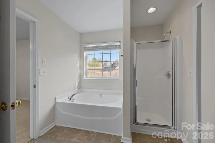 Primary Bath with separate shower and soaking tub