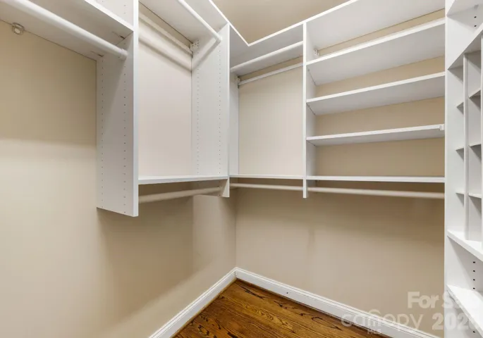 2 of 2 primary closets. 