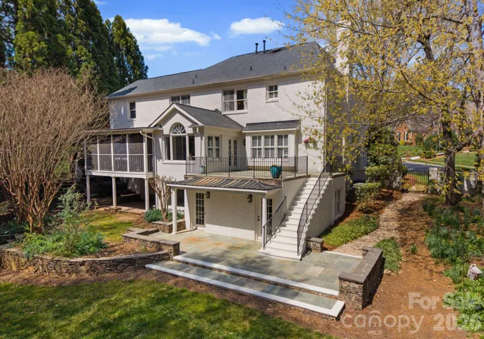 Elevated daytime view of the rear of the home. 