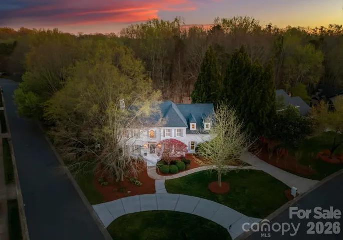 Aerial twilight view of the front of the home. 