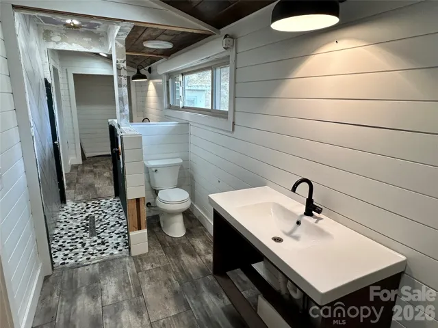 Unfinished shared guest bathrooms