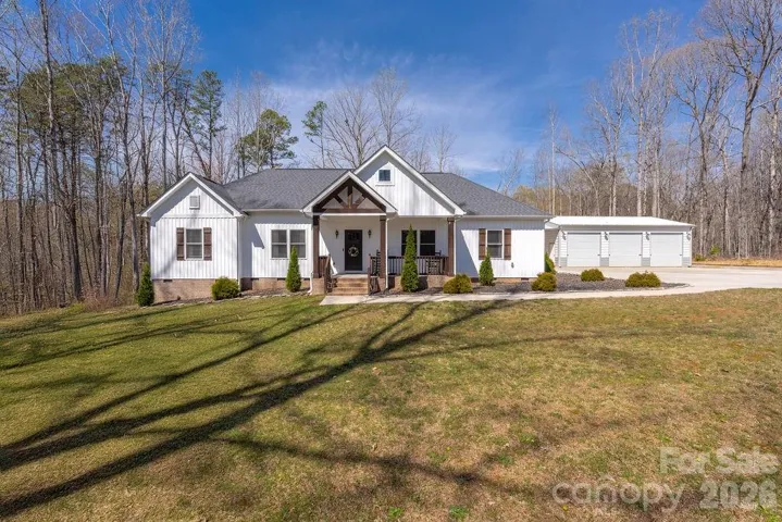 Farmhouse with detached 3 stall garage on 4 acres