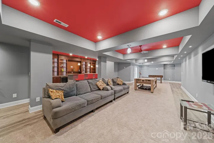 Spacious entertainment lounge offering plenty of room for gaming, movies, or casual gatherings—an ideal retreat for family and friends